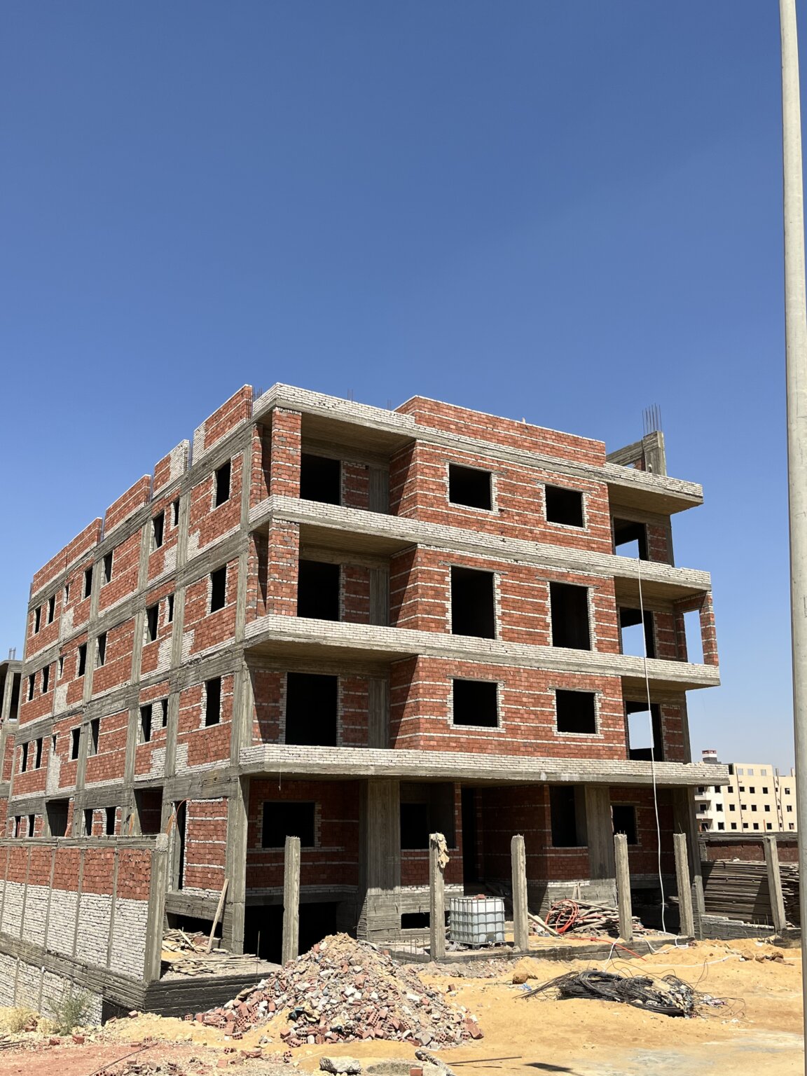واجهات مشروع 11G بالحي الثالث بيت الوطن أثناء أعمال المباني